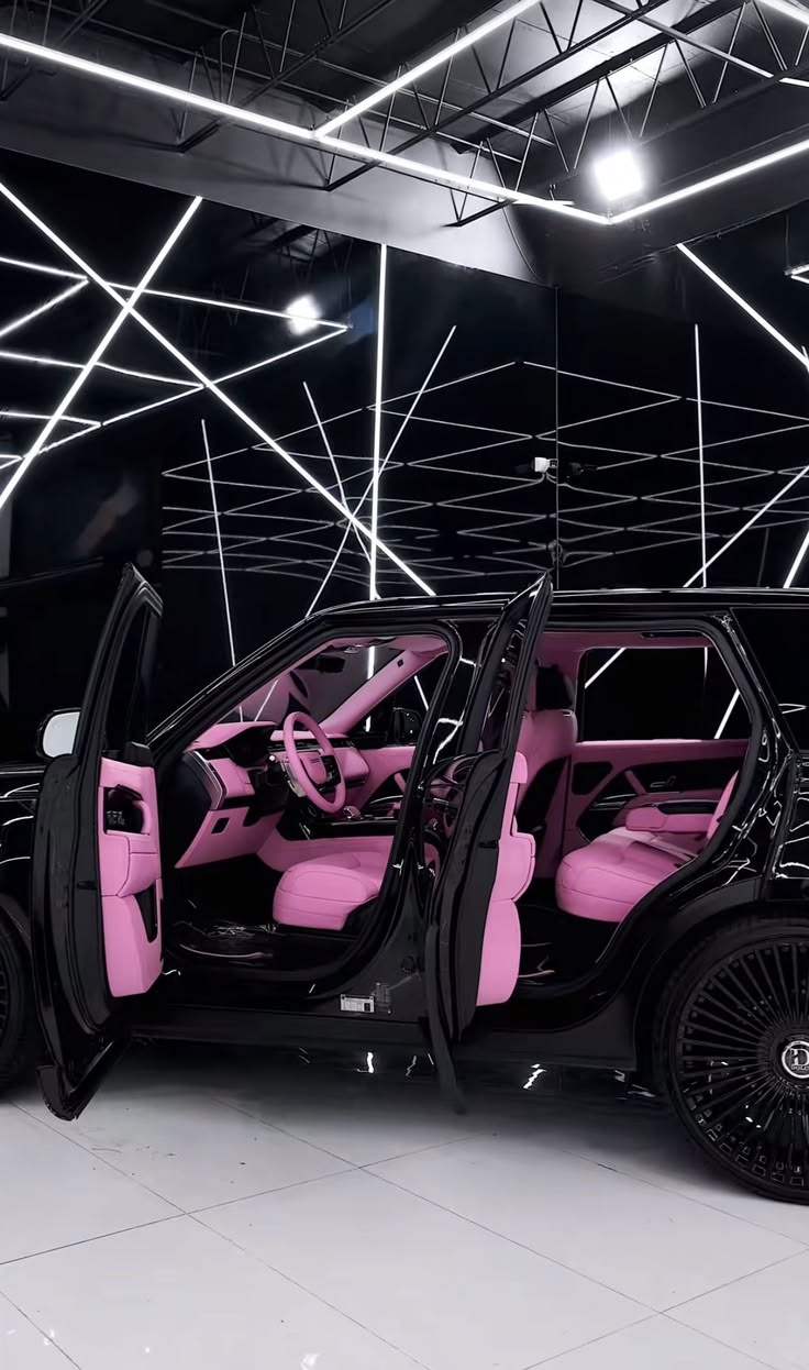 Black luxury SUV with a pink interior representing the Signature Era lifestyle