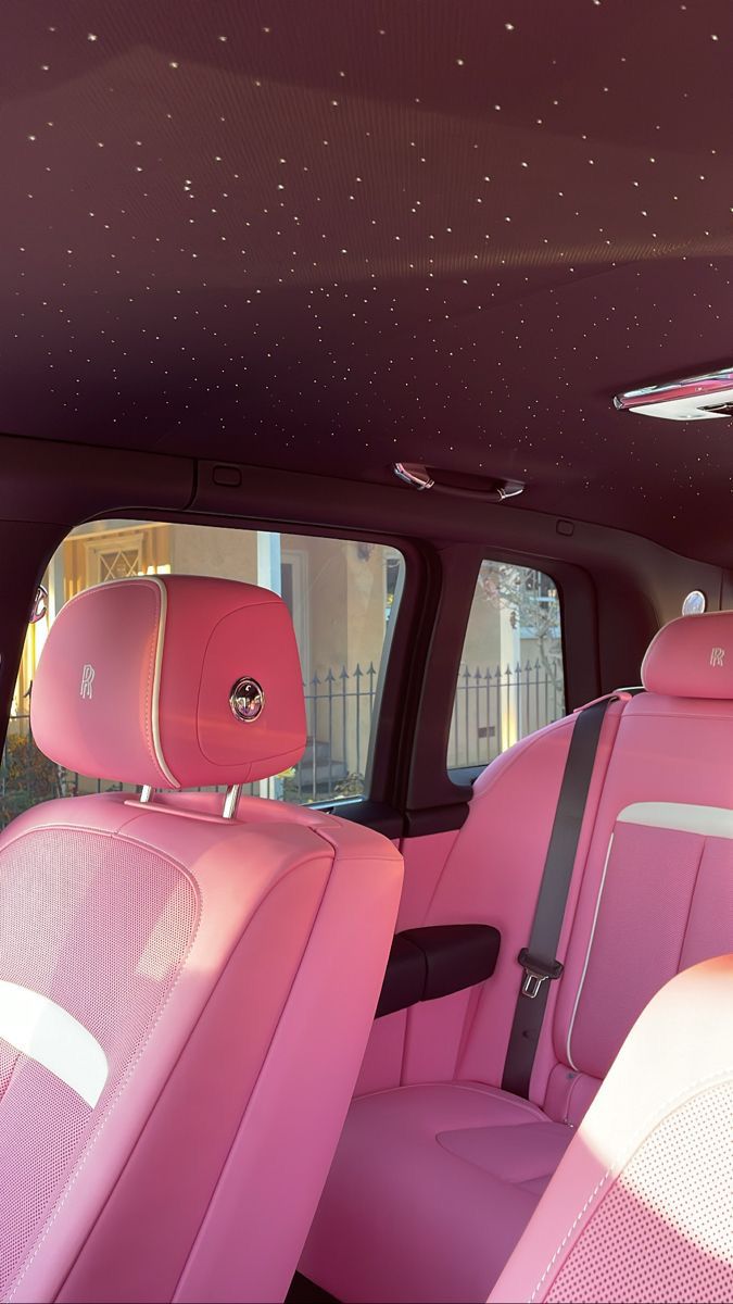 Pink luxury car interior beneath a starlight ceiling
